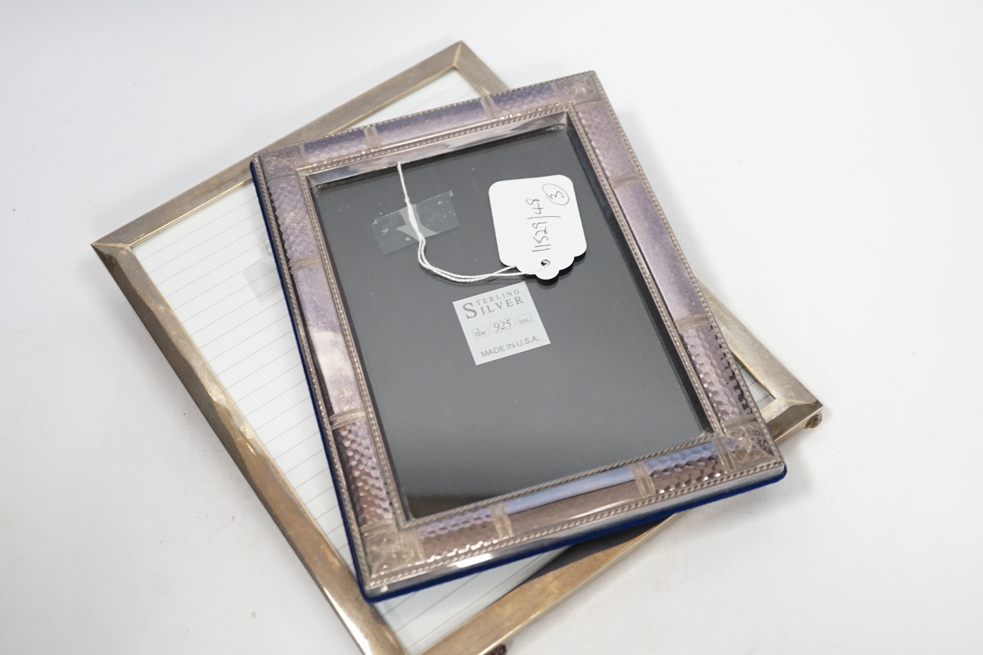 Two modern sterling silver mounted photograph frames, 21cm and a larger unmarked frame, 25cm